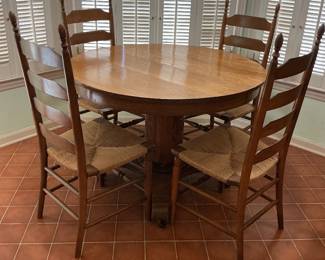 Antique round oak table.. has 3 leafs…has been beautifully restored!