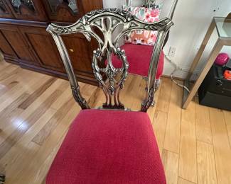 (Vetify qty)8 mahogany chippendale style dining chairs on ball and claw feet, 2 w/ arms (27"w x 19"d x 39"H). Upholstered in a red and gold fleur-de-lis patterned fabric.
