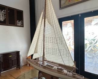 Yacht with fabric sails& polished wooden hull