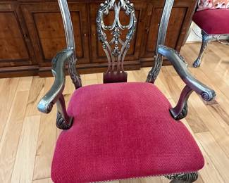 (Vetify qty)8 mahogany chippendale style dining chairs on ball and claw feet, 2 w/ arms (27"w x 19"d x 39"H). Upholstered in a red and gold fleur-de-lis patterned fabric.