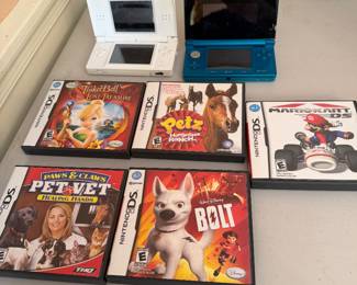 Two Nintendo DS game boys and  five games
