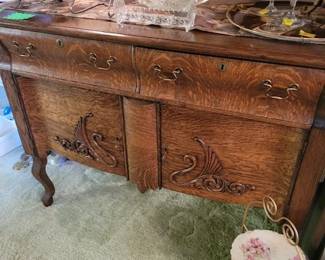 Antique Swan Carved Front 2 drawer Buffet. Topped with Crystal sna Red Glass oversized Wine Glasses