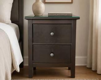 Lot #63 - Modern Ikea Hemnes Black-Brown Wooden 2-Drawer Nightstand with Glass Top