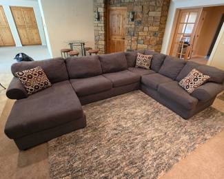 Lot #89 - Modern Three Piece Pewter Sectional Sofa with Chaise and Patterned Throw Pillows