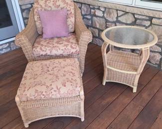 Lot #70 - Classic Wicker Patio Set - Armchair, Ottoman, Glass Top Side Table