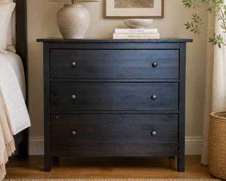 Lot #62 - Modern Ikea Hemnes Black-Brown Three-Drawer Wooden Dresser