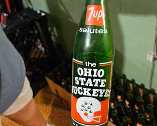 Ohio State commerative 7-UP bottles from 1973 displaying winning championships on opposite side. 42 bottles
