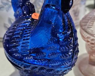 COBALT ROOSTER ON NEST