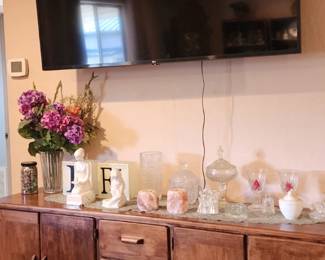 Large Wall-Mounted Flat-Screen TV & Wood Credenza – Oversized flat-screen TV in working condition. Below is a substantial wood credenza/buffet featuring multiple drawers and cabinet storage. Both available for sale separately. Decorative items also available throughout the sale.