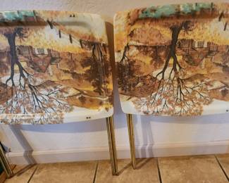 Matching Pair of Vintage Scenic Folding Chairs – Charming mid-century style folding chairs featuring woodland/cottage scene upholstery with slender metal legs. Unique collectible vintage seating in a matching pair.