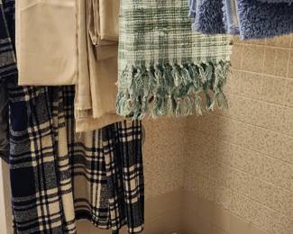 BATHROOM & LINENS – Shower curtains, bath towels, washcloths, robe, bath linens and assorted personal care/health supplies.
