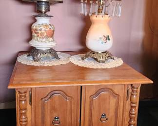 Pair of Vintage Floral Hurricane-Style Table Lamps with Decorative Glass Shades & Ornate Bases, displayed on a Traditional Two-Door Wood Accent Cabinet. Lamps and cabinet sold separately.