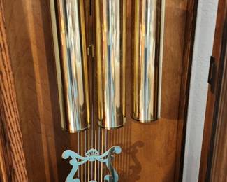 Beautiful circa 1991 Sligh Grandfather Clock, made in Holland, Michigan, USA. Features a gorgeous oak case with ornate carved detailing, moon phase dial, three brass weights and pendulum. In excellent working condition with a beautiful, rich chime. Registered in 1991. A wonderful statement piece with classic Sligh craftsmanship.