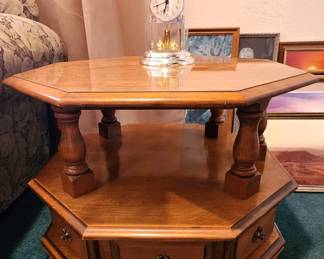 Traditional Octagonal Two-Tier Wood End Table – Beautiful warm wood finish with turned supports, lower display shelf and built-in storage drawers with decorative brass-tone hardware. Unique, substantial accent piece with lots of character.