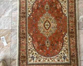 small handmade Indoa peach rug