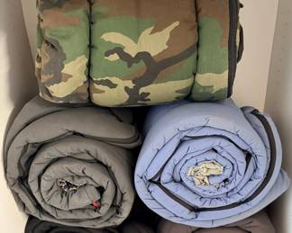 Collection of Assorted Sleeping Bags and Outdoor Gear