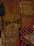 Large selection of old Oriental rugs, runners, and wall hangings