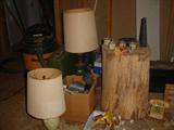 More old lamps, along with a vintage wooden chopping block