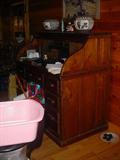 Old "rolltop" style desk, with Acoma pottery vases on top