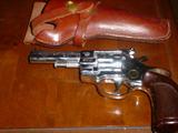 One of the many hand guns, rifles, shotguns, and muzzle loaders...see partial list in the listing descriptions