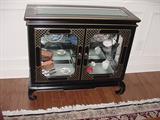 Another Oriental style back laquered small hutch display cabinet, full of collectible glass and porcelains