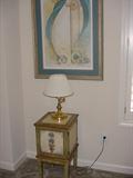 More of the several small tables, lamps, and art forms.