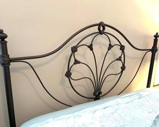 Queen metal headboard w/circle center motif, $125