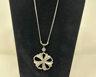 Silver necklace with flower pendant, $12