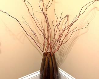 Brown vase with twig arrangement, $34
