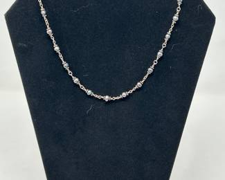 Delicate silver-tone necklace small grey pearls and metal bead accents, $12