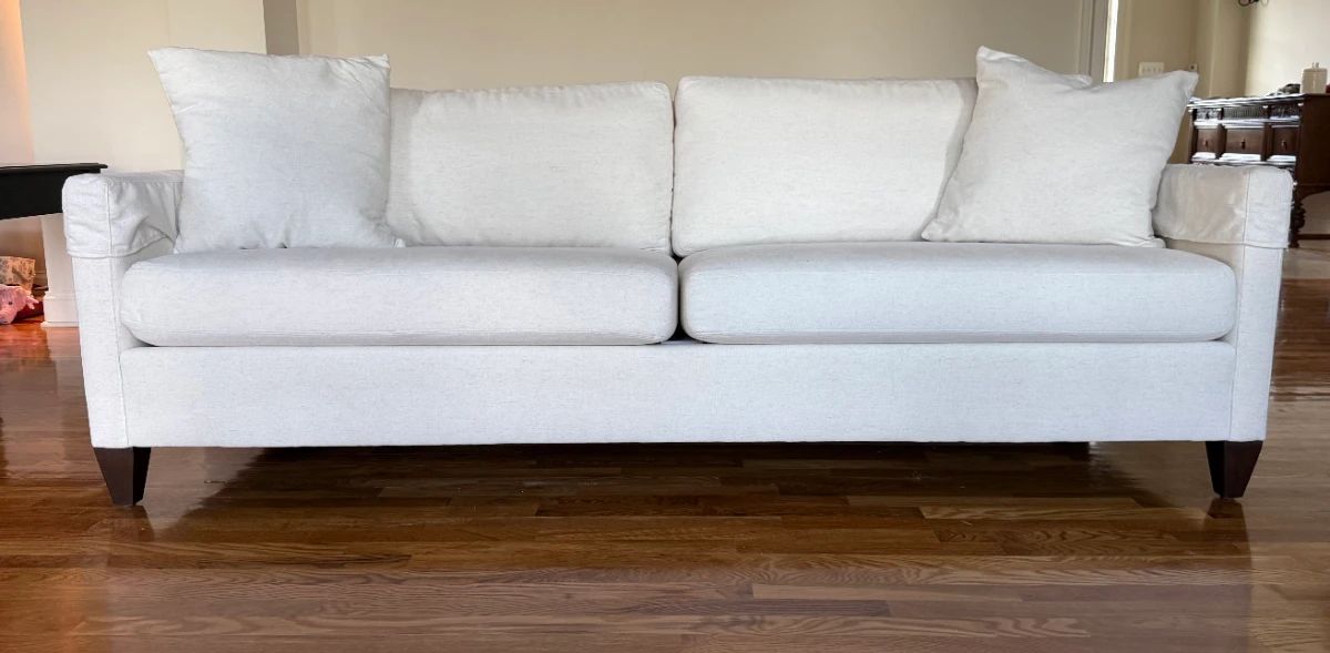 Ethan Allen custom upholstered sofa| 88" wide | Clean off-white textured fabric | Clean traditional styling, slim track arms, two generous loose seat cushions, comfortable loose back cushions and coordinating oversize pillows