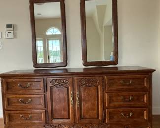 Ornate Solid Wood Dresser with 2 matching mirrors. Dresser contains 6 drawers and center cabinet has drawers too.