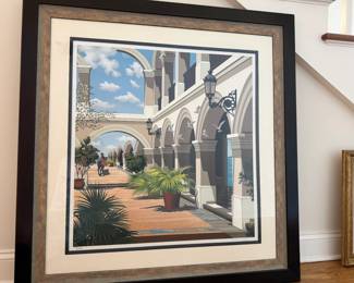 Frederick Phillips-Limited Edition Architectural Print: Arcanum. Striking limited-edition serigraph silkscreen on paper. Phillips, known for his highly detailed architectural scenes with strong perspective, dramatic light and Mediterranean-inspired settings. This piece depicts a sunlit colonnade with sweeping arches, ornamental lanterns, lush greenery and birds in flight beneath a bright blue sky. The work is pencil signed by Phillips at the lower right, making it part of a relatively small limited edition. Edition: 238/295 Size: 28 x 30 inches