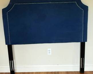 Safavieh Shayne Navy Upholstered Full-Size Headboard. Elegant navy blue upholstered headboard featuring a tailored notched silhouette with silver-tone nailhead trim Thickly padded for comfort with dark wood legs and adjustable mounting slots. Excellent condition.