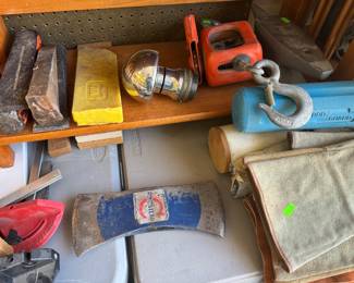 wedges, axe blades, engraver's ball vise, hoist, anvil, welding stuff