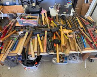 assorted hammers, mallets, hatchets, pipe wrenches, bolt cutters, pry bars