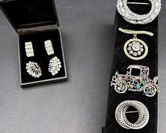 Rhinestone And Silver-Toned Brooches And Clip-On Earrings