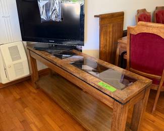 Small tv and glass top sofa table.