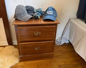 Night stand and hats. 