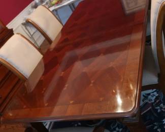 Dining room table and 6 chairs. There are 2 leaves and pads. 72" x 42"