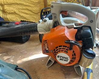 Stihl BG 50 Gas Handheld Leaf Blower This Stihl BG 50 gas handheld leaf blower features the orange and white Stihl housing with the "STIHL BG 50" model badge on the recoil starter cover and "STIHL" embossed on the blower tube. The BG 50 is Stihl's entry-level gas blower, known for lightweight handling and easy starting with a fuel-efficient engine. This unit shows moderate use with light dirt buildup and minor scuffing consistent with regular yard work. A reliable gas leaf blower for residential yard cleanup and driveway clearing. Working condition not confirmed — sold as found.