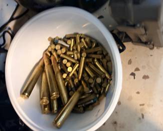 Mixed-Caliber Live Ammunition Lot This lot includes a bucket of live, unfired ammunition in mixed rifle and pistol calibers. Visible cartridges include .30-caliber rifle rounds and assorted smaller-caliber pistol and rifle cartridges, all with intact primers and seated projectiles. A bulk ammunition lot for shooters, hunters, and sportsmen looking to stock up at estate sale pricing — confirm calibers by headstamp in person. Check local CTBids and state regulations on ammunition sales before listing.