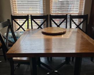 Dining table converts from square to round seating six 