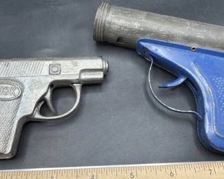 Vintage metal toy guns.