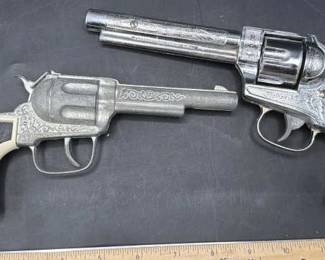 Western metal toy cap guns. Cowboy.