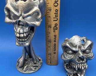 Pewter skull art / figures.