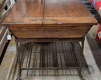 One of a pair of vintage lift-top storage tables