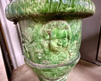 One of two gorgeous, green-glazed terracotta Anduze planters with cherub accents
