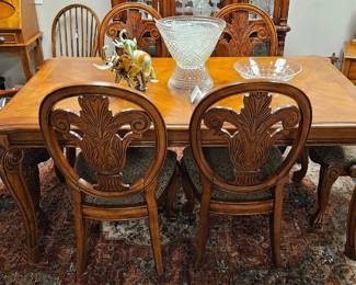 Dining set with one leaf and six ornately carved chairs