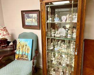 Display case full of collectible Precious Moments figurines!
